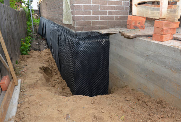 Happy homeowners after waterproofing job in Fort George G Meade